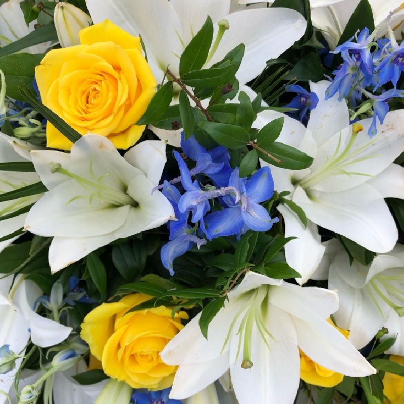 white-lilies-yellow-roses-blue-delphiniums-lily-casket-coffin-spray-funeral-flowers-tribute-delivered-strood-rochester-medway-kent