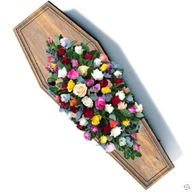mixed-roses-red-pink-yellow-orange-lilac-coffin-casket-spray-funeral-flowers-delivered-strrod-rochester-medway-kent