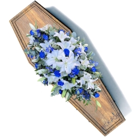 Blue-roses-delphiniums-white-lilies-casket-coffin-casket-spray-delivered-strood-Rochester-Medway-kent
