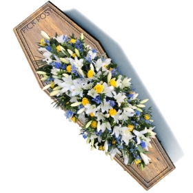 white-lilies-yellow-roses-blue-delphiniums-lily-casket-coffin-spray-funeral-flowers-tribute-delivered-strood-rochester-medway-kent